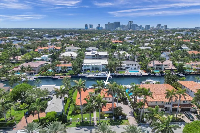 a view of a backyard with plants and a patio