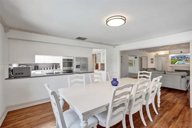 a kitchen with granite countertop a sink and cabinets