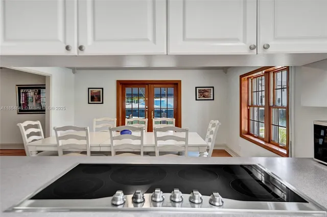 a kitchen with a refrigerator and a stove
