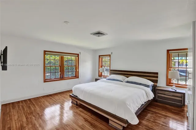 a bathroom with a sink vanity mirror and toilet