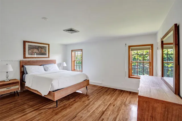 a bed room with a bed and a window