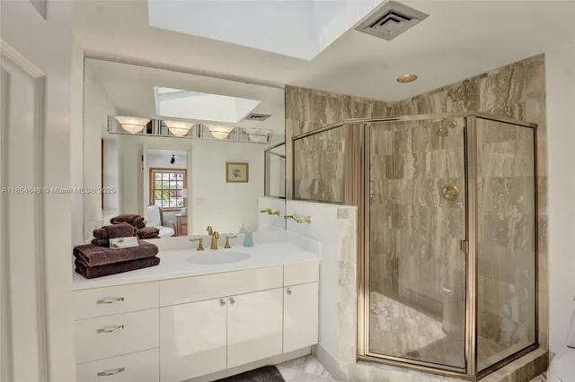 a patio with hardwood chairs and lake view