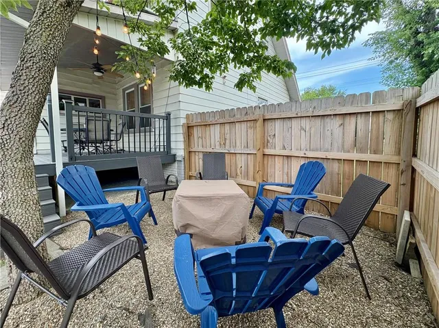 a view of a chairs and table in the patio