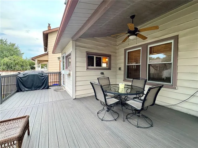 a view of a patio with table and chairs