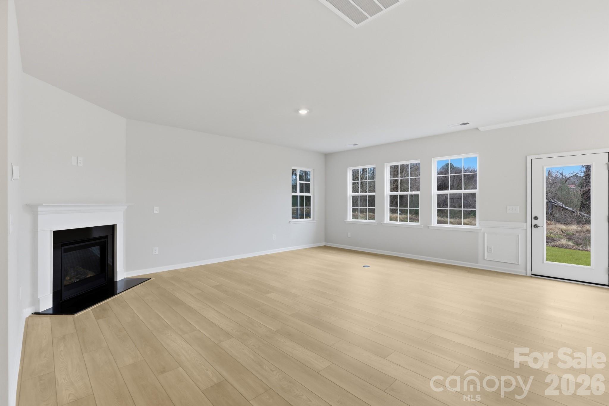 5450 Redbud Road, Unit 66 Lancaster, SC 29720 - Photo 13 of 35 a view of an empty room with a window and fireplace