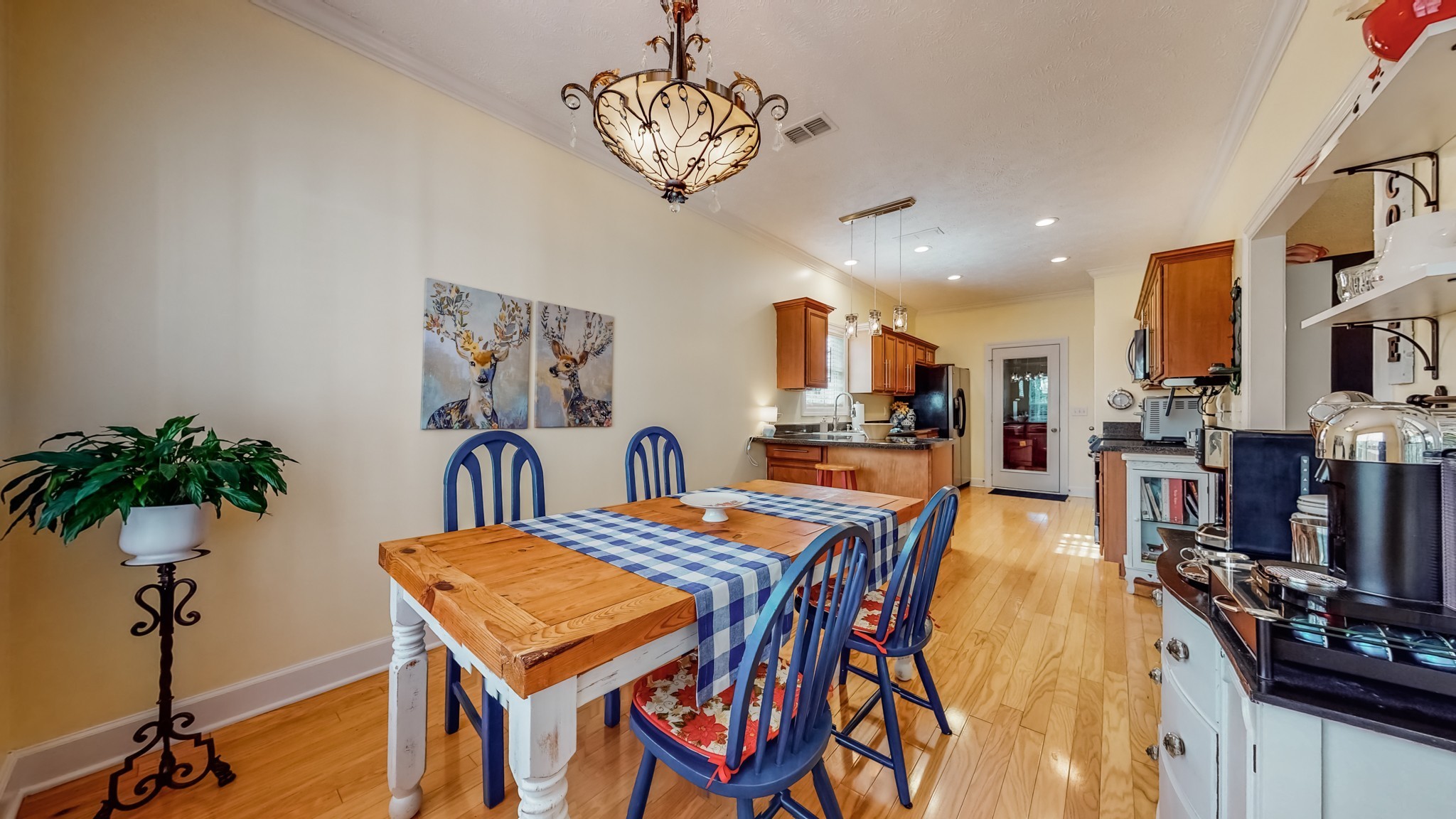 1815 Potters Court Murfreesboro, TN 37128 - Photo 15 of 49 a view of a dining room with furniture and a kitchen