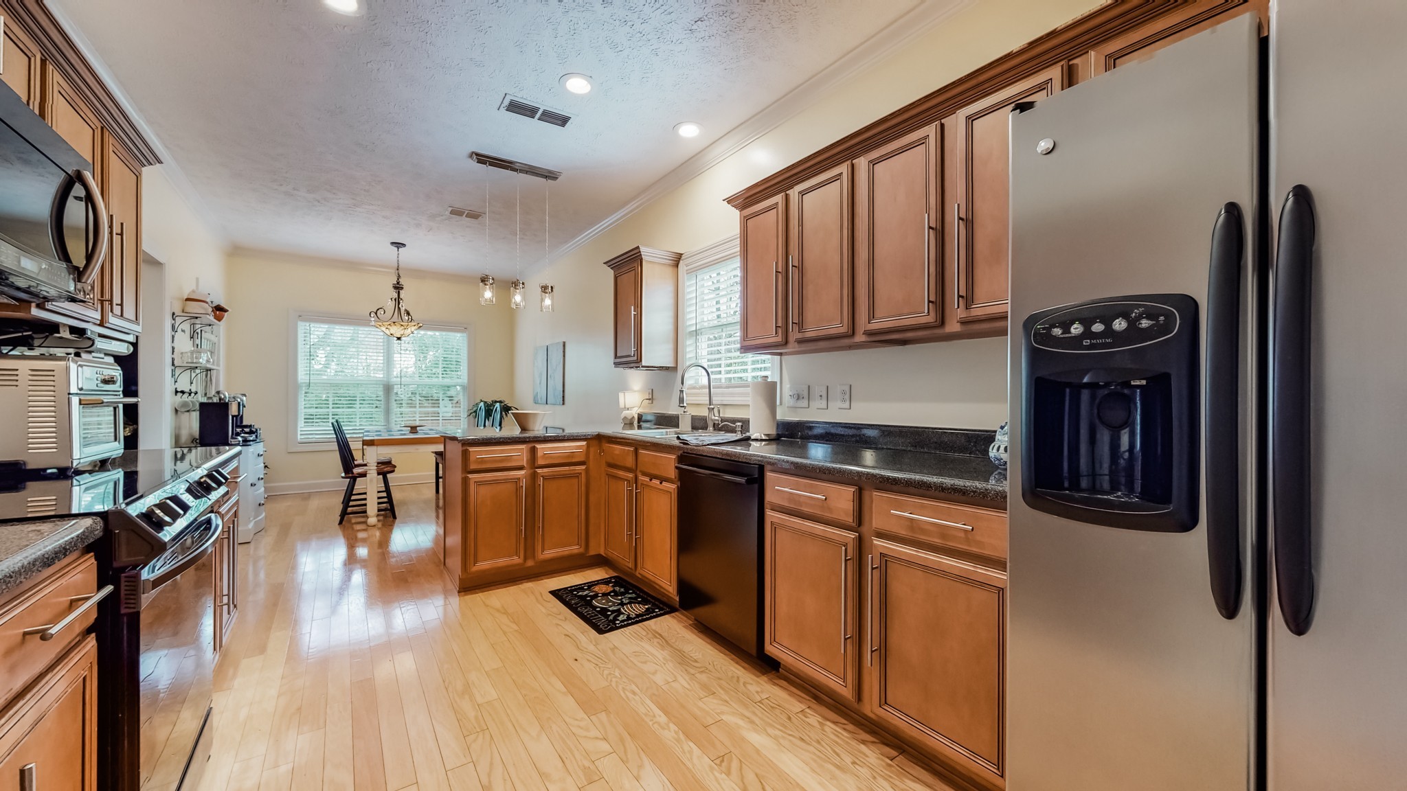 1815 Potters Court Murfreesboro, TN 37128 - Photo 17 of 49 a kitchen with stainless steel appliances granite countertop a refrigerator a stove top oven a sink and dishwasher