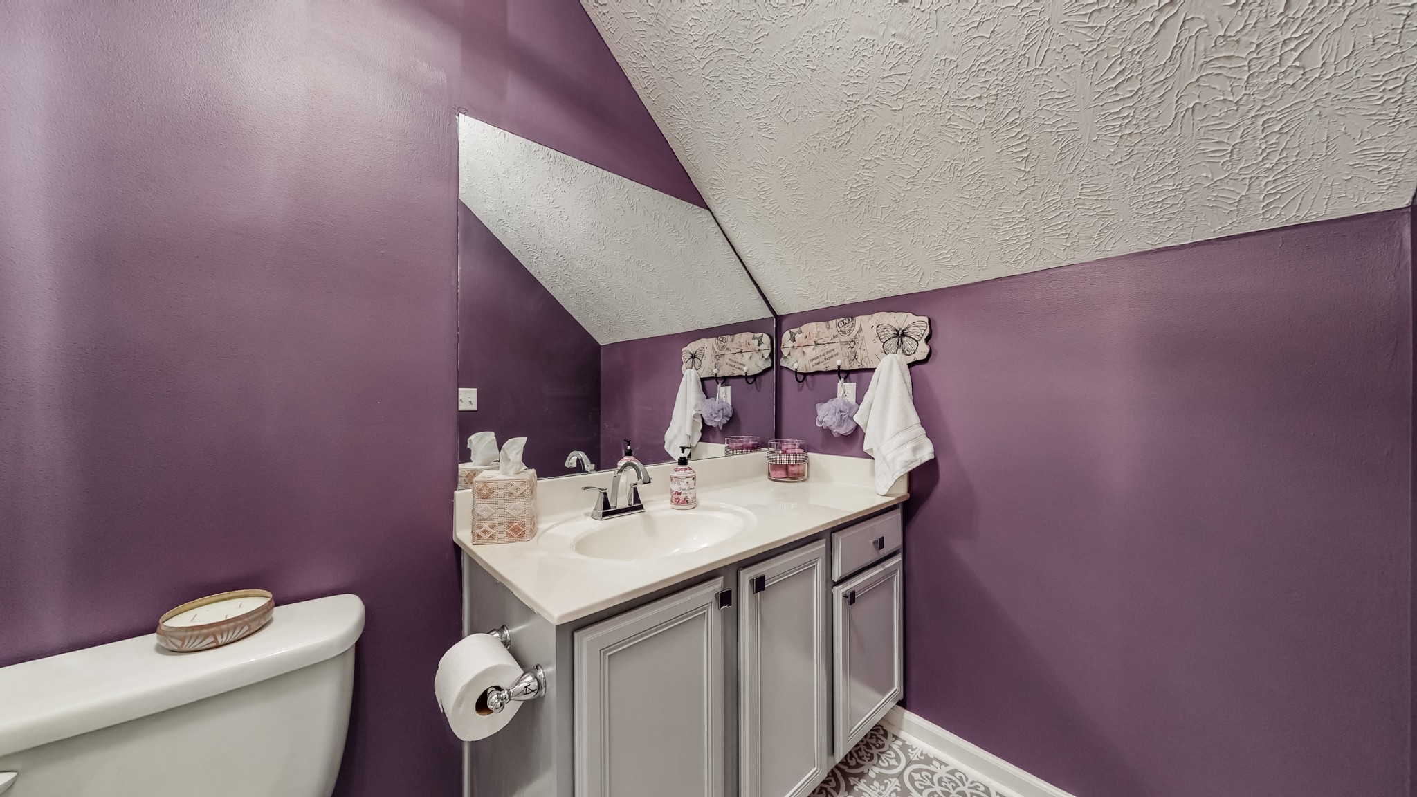 1815 Potters Court Murfreesboro, TN 37128 - Photo 40 of 49 a bathroom with a sink a toilet and mirror