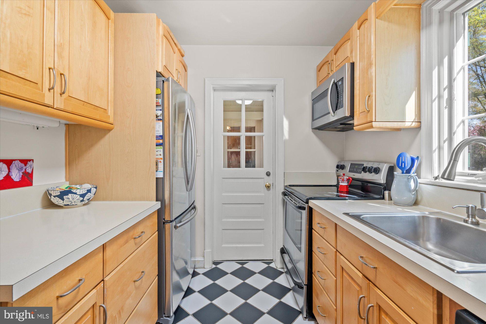 4001 Franconia Road Alexandria, VA 22310 - Photo 14 of 40 a kitchen with kitchen island a sink stove and cabinets
