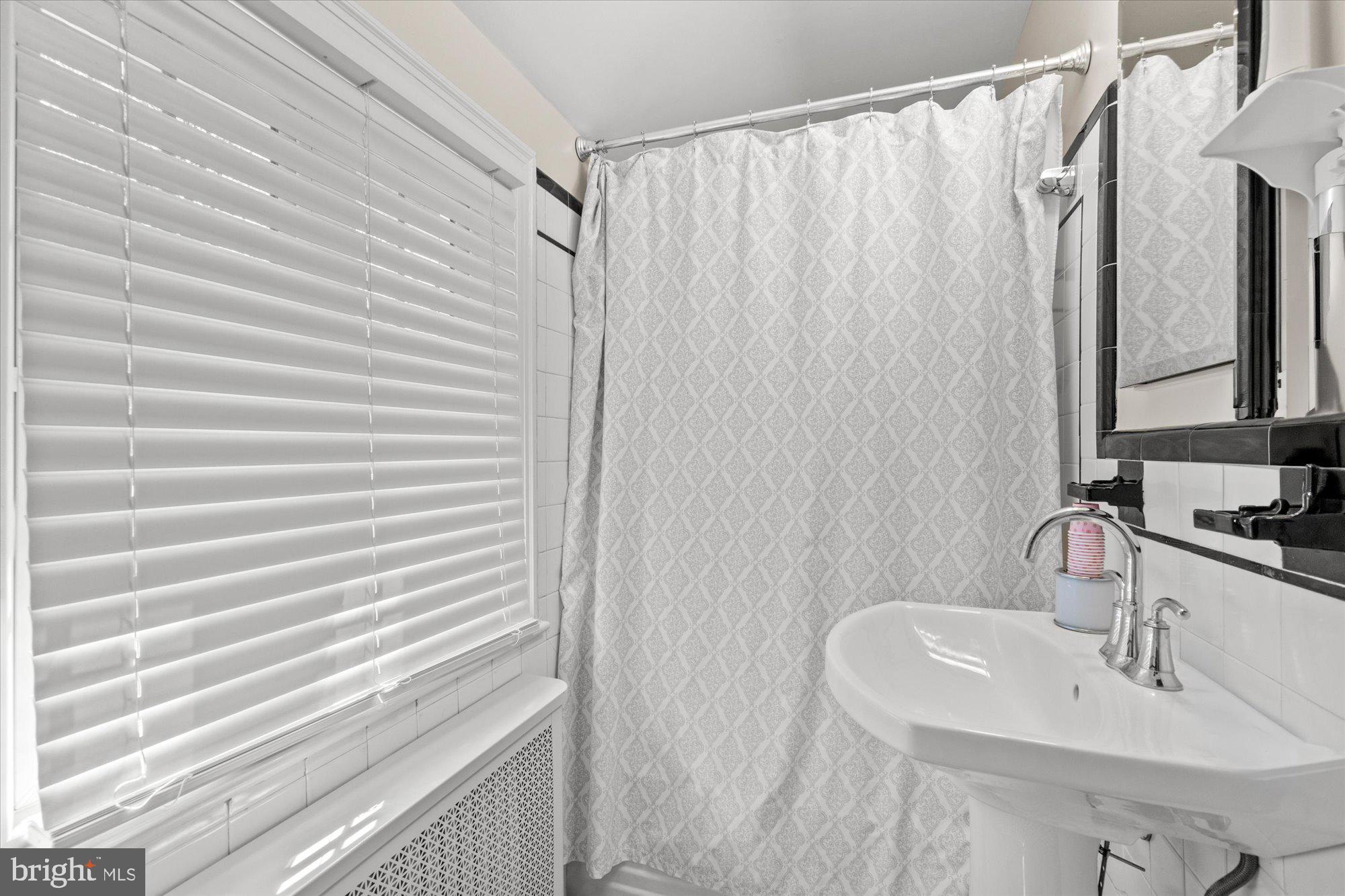 4001 Franconia Road Alexandria, VA 22310 - Photo 22 of 40 a bathroom with a sink and a mirror