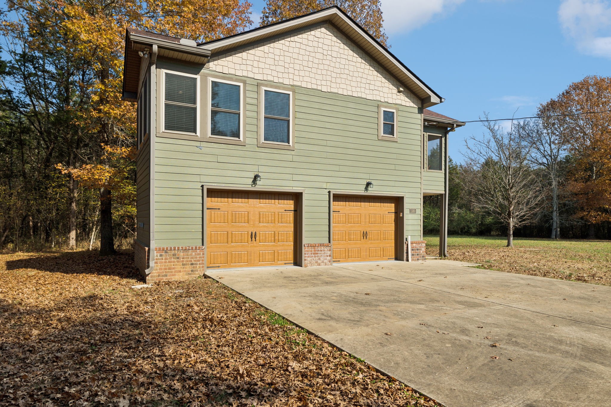 1560 River Road Chapel Hill, TN 37034 - Photo 30 of 80 a front view of a house with a yard and garage