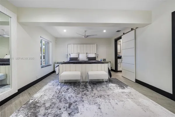 a living room with furniture and kitchen view