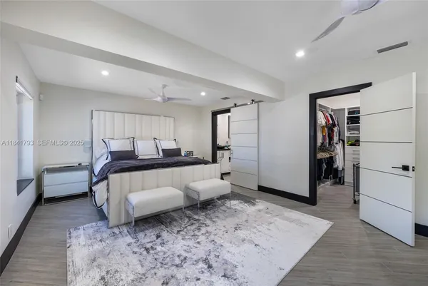 a living room with furniture and a rug