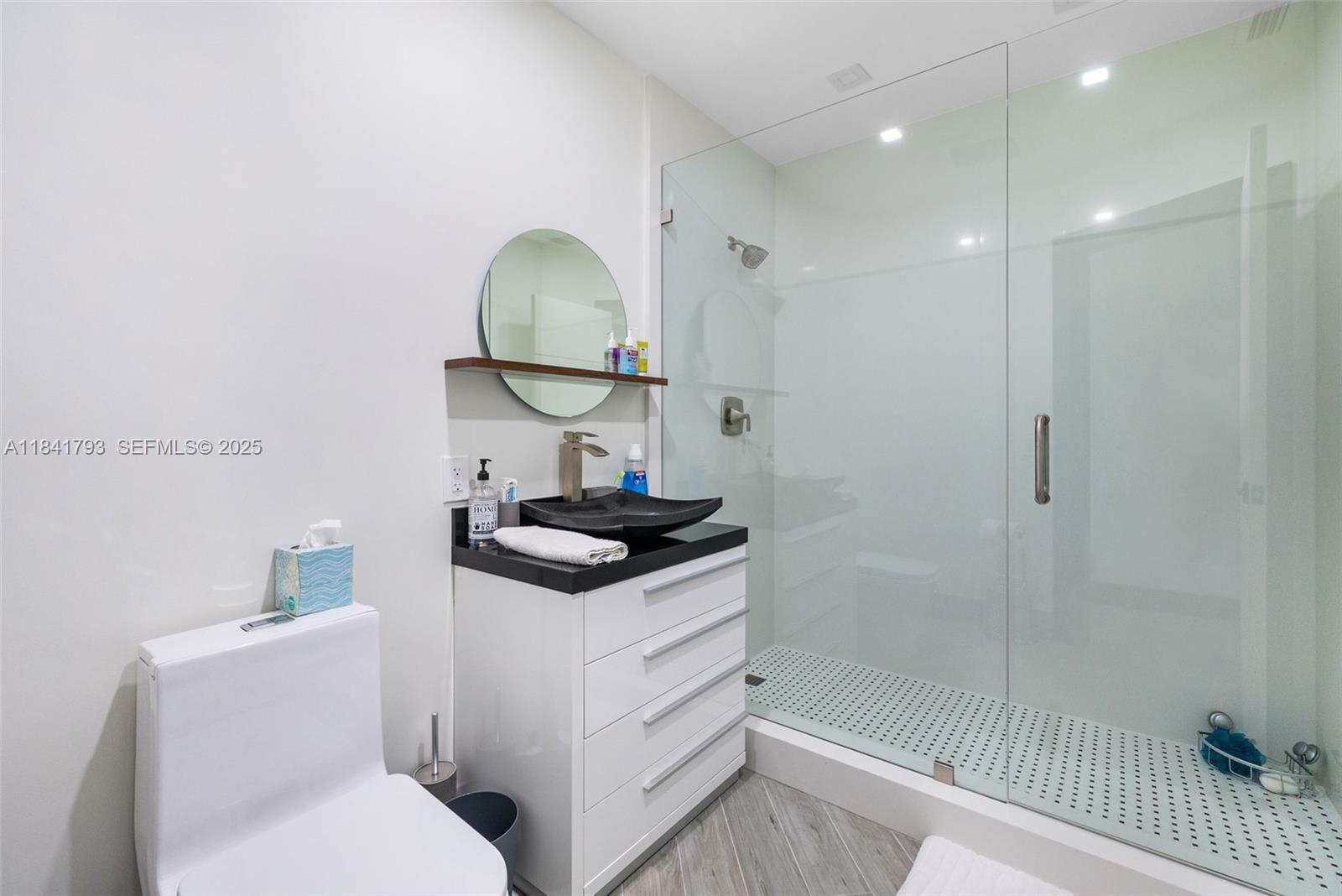 517 South Riverside Drive Pompano Beach, FL 33062 - Photo 5 of 21 a bathroom with a sink a toilet and shower