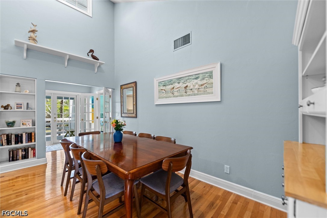 5304 Ladyfinger Lake Road Sanibel, FL 33957 - Photo 11 of 48 a view of a dining room with furniture and wooden floor