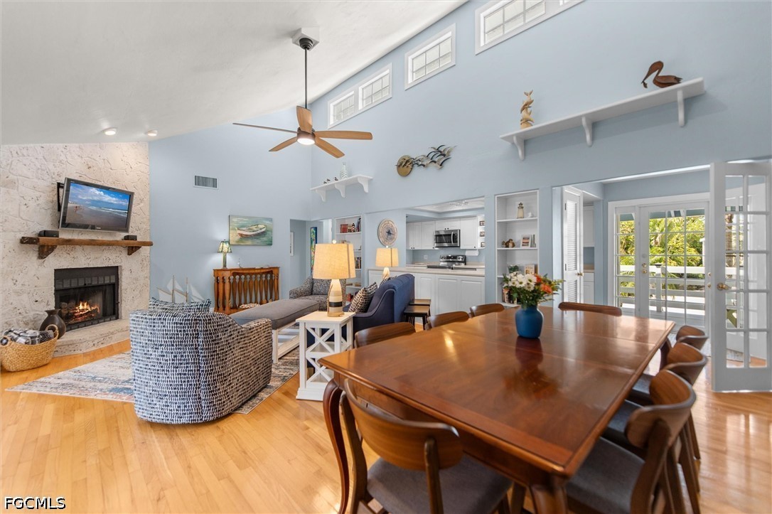 5304 Ladyfinger Lake Road Sanibel, FL 33957 - Photo 12 of 48 a living room with fireplace furniture and a wooden floor