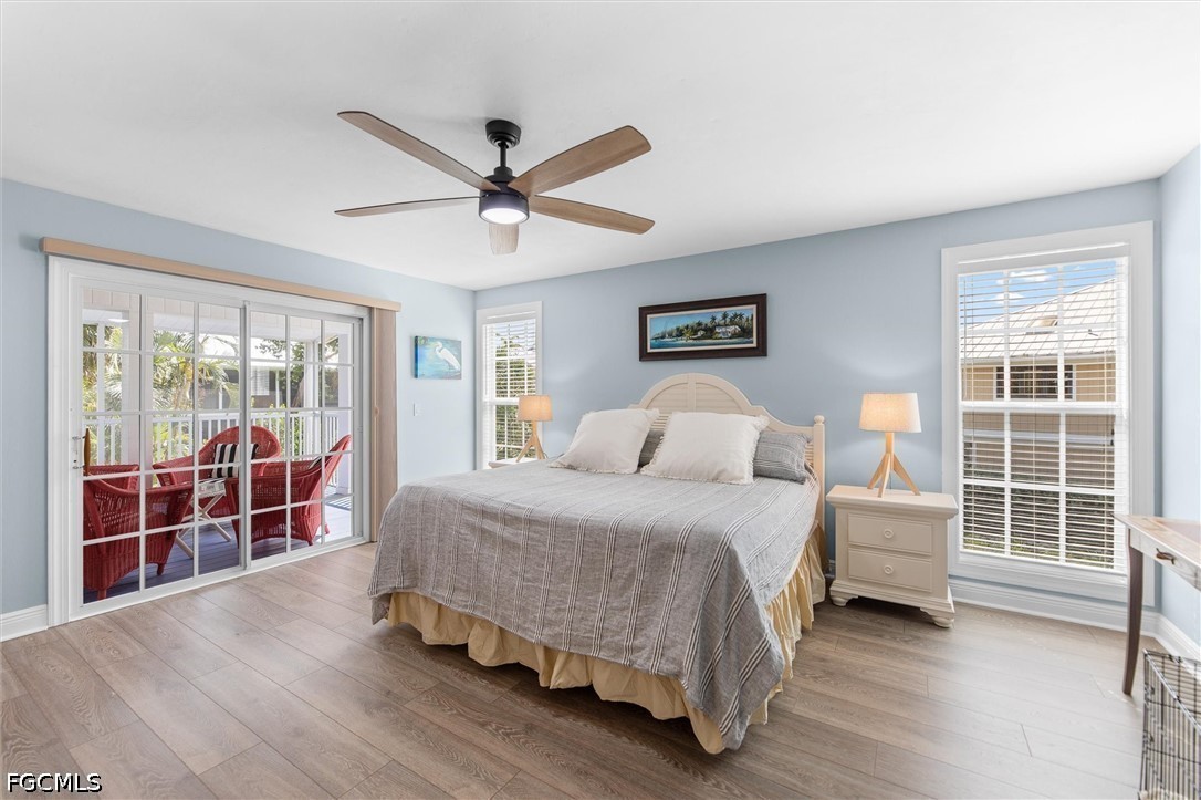 5304 Ladyfinger Lake Road Sanibel, FL 33957 - Photo 15 of 48 a bedroom with a bed and a large window