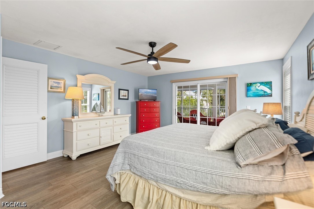 5304 Ladyfinger Lake Road Sanibel, FL 33957 - Photo 16 of 48 a bed room with a bed and a large window