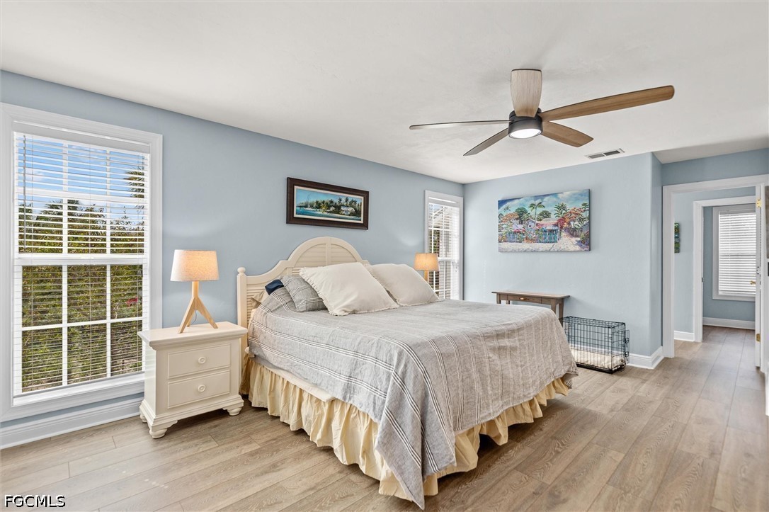 5304 Ladyfinger Lake Road Sanibel, FL 33957 - Photo 17 of 48 a bedroom with a bed and a window