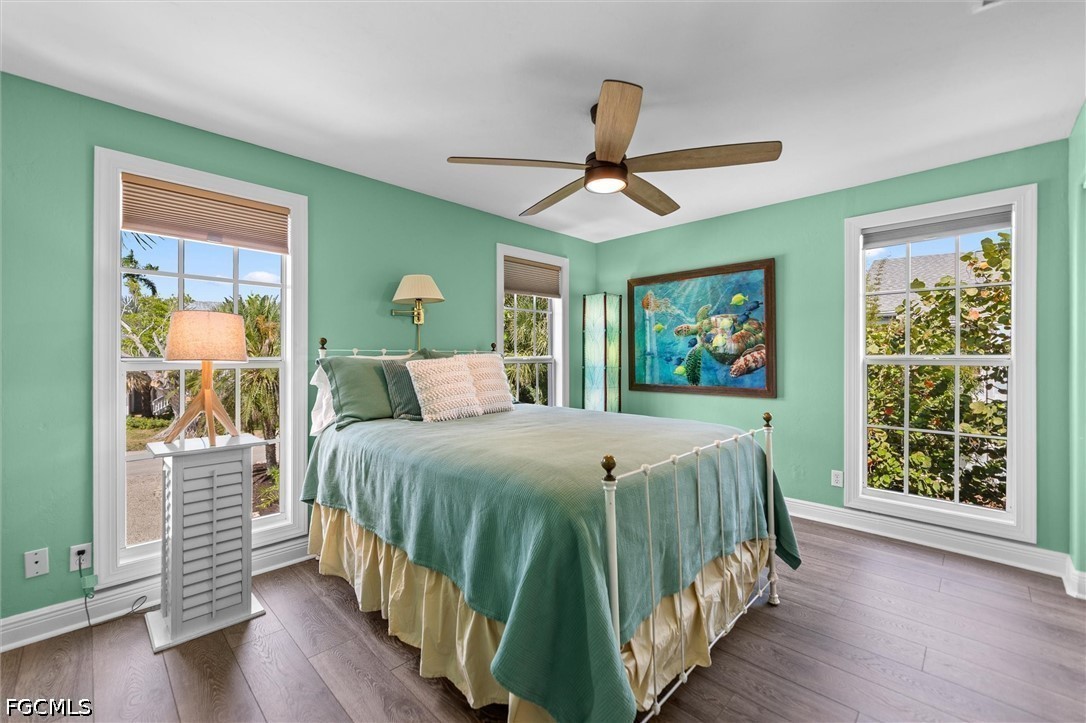 5304 Ladyfinger Lake Road Sanibel, FL 33957 - Photo 22 of 48 a bedroom with a large bed and a window