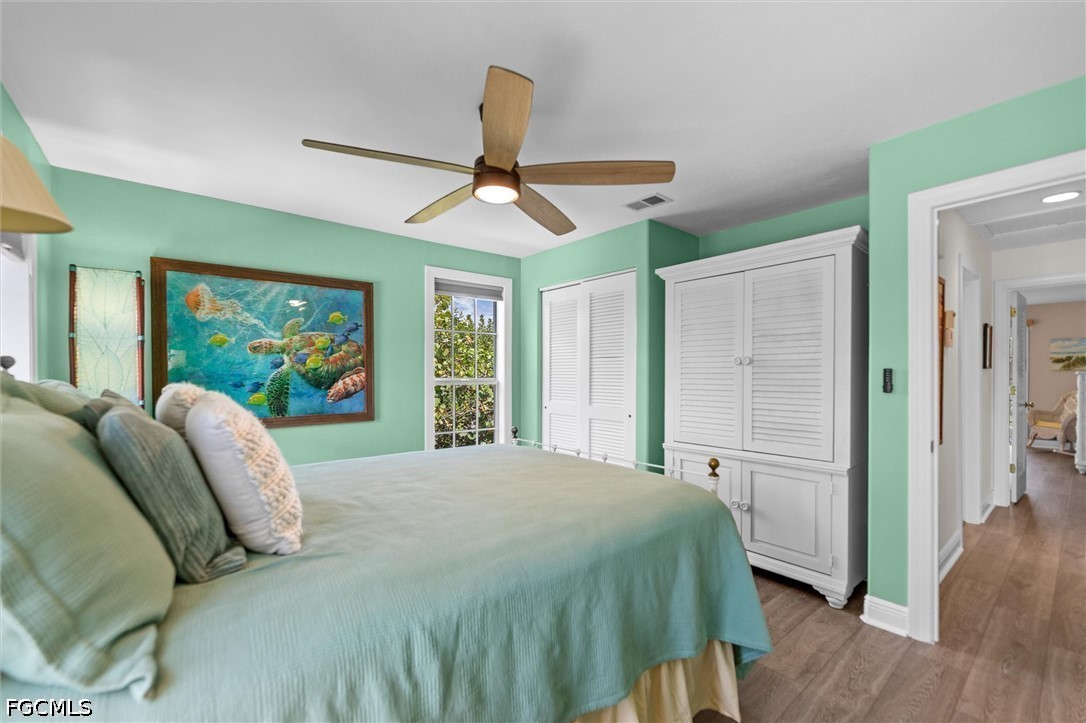 5304 Ladyfinger Lake Road Sanibel, FL 33957 - Photo 23 of 48 a bedroom with a bed and a large window