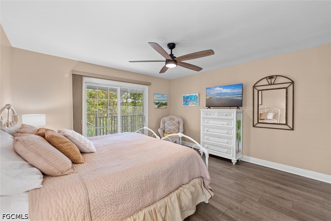 5304 Ladyfinger Lake Road Sanibel, FL 33957 - Photo 27 of 48 a bedroom with a bed dresser and a window