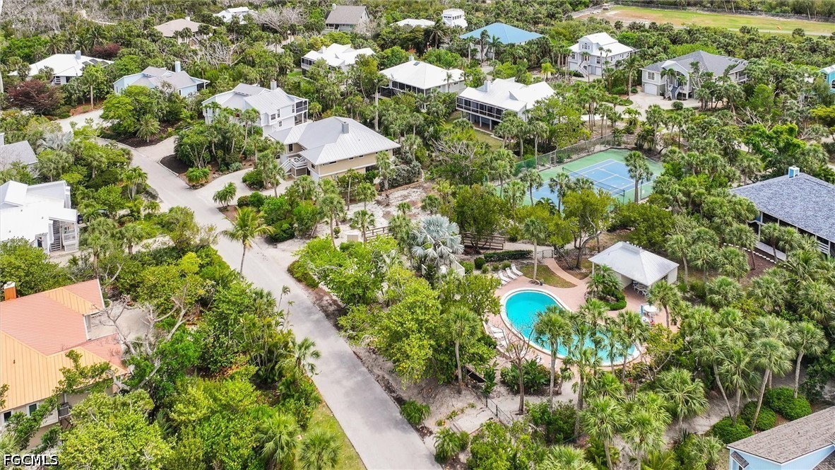 5304 Ladyfinger Lake Road Sanibel, FL 33957 - Photo 36 of 48 an aerial view of a house with a yard and swimming pool