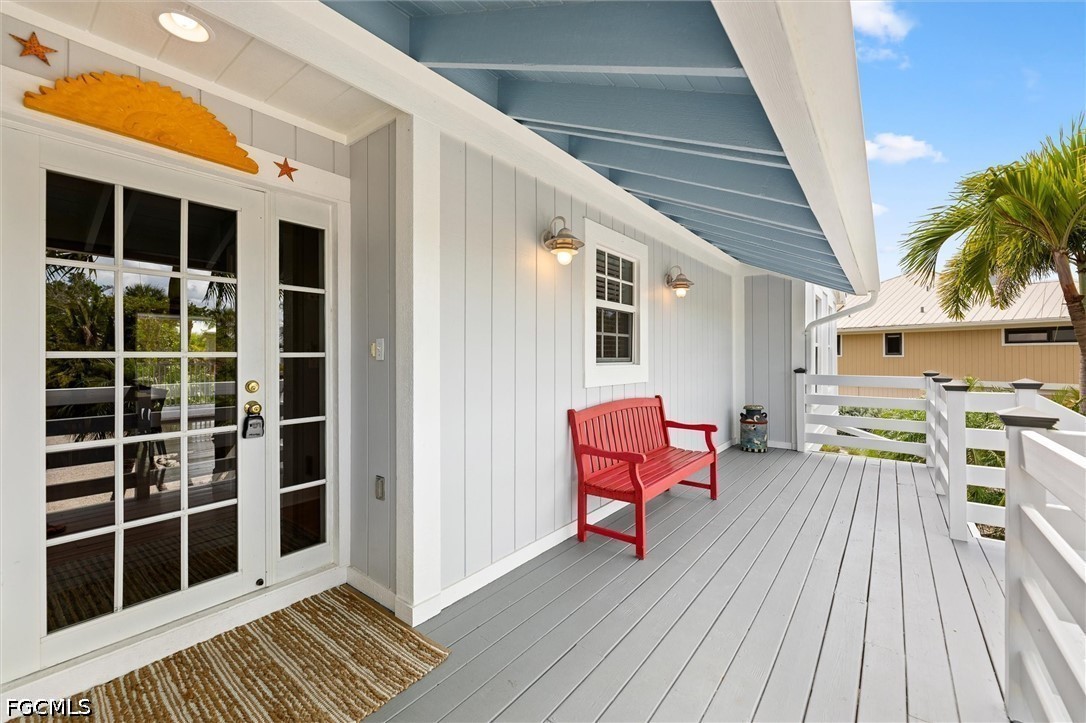 5304 Ladyfinger Lake Road Sanibel, FL 33957 - Photo 4 of 48 a view of a patio with wooden floor and seating space