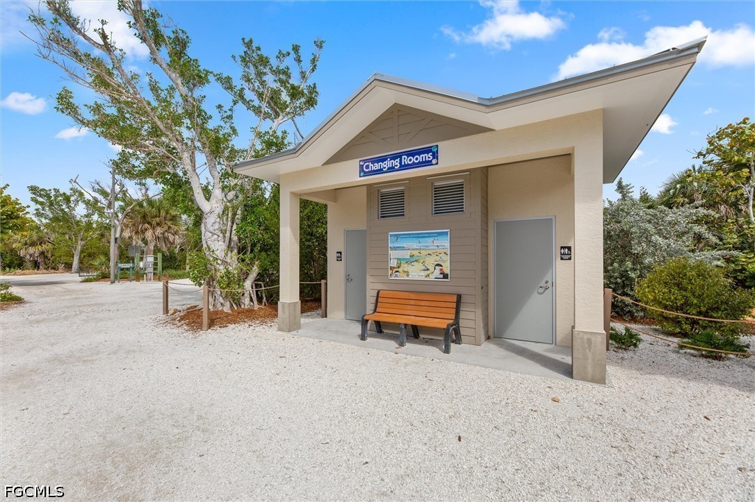 5304 Ladyfinger Lake Road Sanibel, FL 33957 - Photo 46 of 48 a view of a two chair in the patio and a fountain