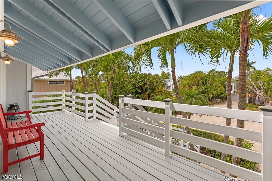 5304 Ladyfinger Lake Road Sanibel, FL 33957 - Photo 5 of 48 a view of balcony with chairs and wooden fence