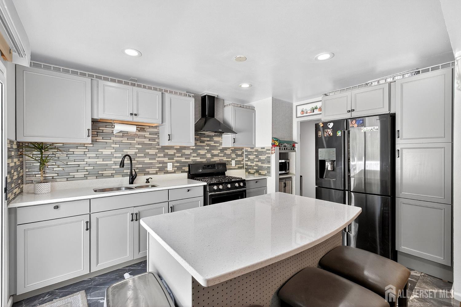 124 Cindy Court Middlesex, NJ 08846 - Photo 11 of 27 a kitchen with stainless steel appliances a refrigerator sink and cabinets
