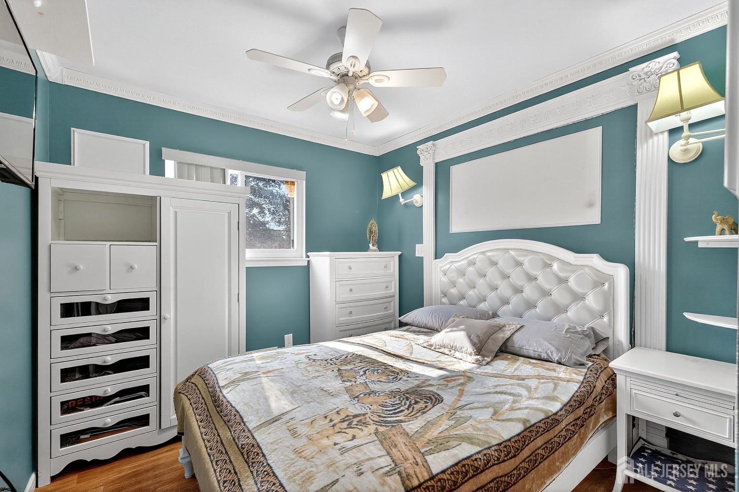 124 Cindy Court Middlesex, NJ 08846 - Photo 16 of 27 a bedroom with a bed and a chandelier