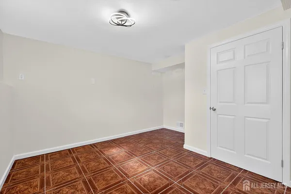 an empty room with a bench