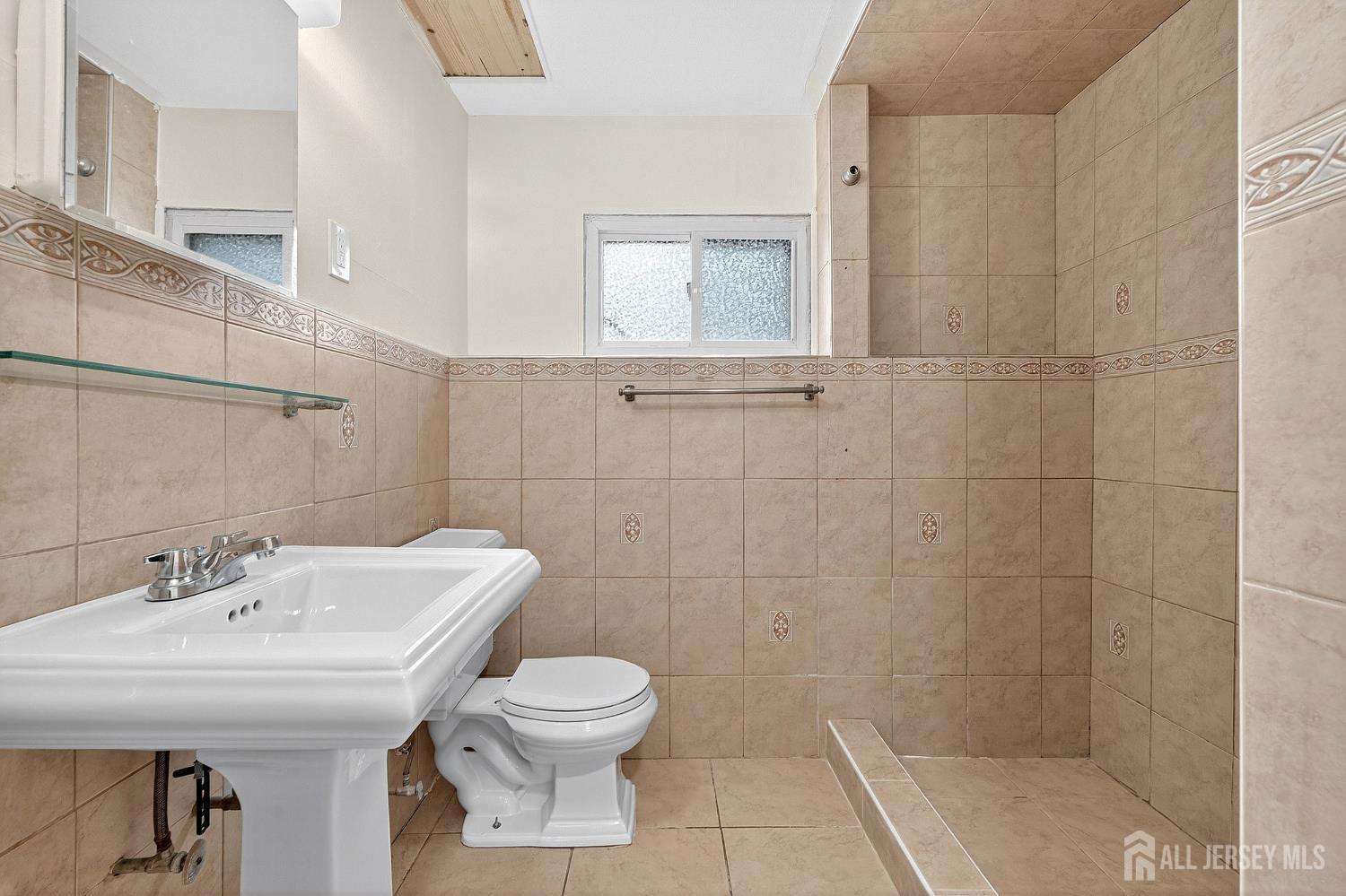 124 Cindy Court Middlesex, NJ 08846 - Photo 22 of 27 a bathroom with a sink a toilet and shower