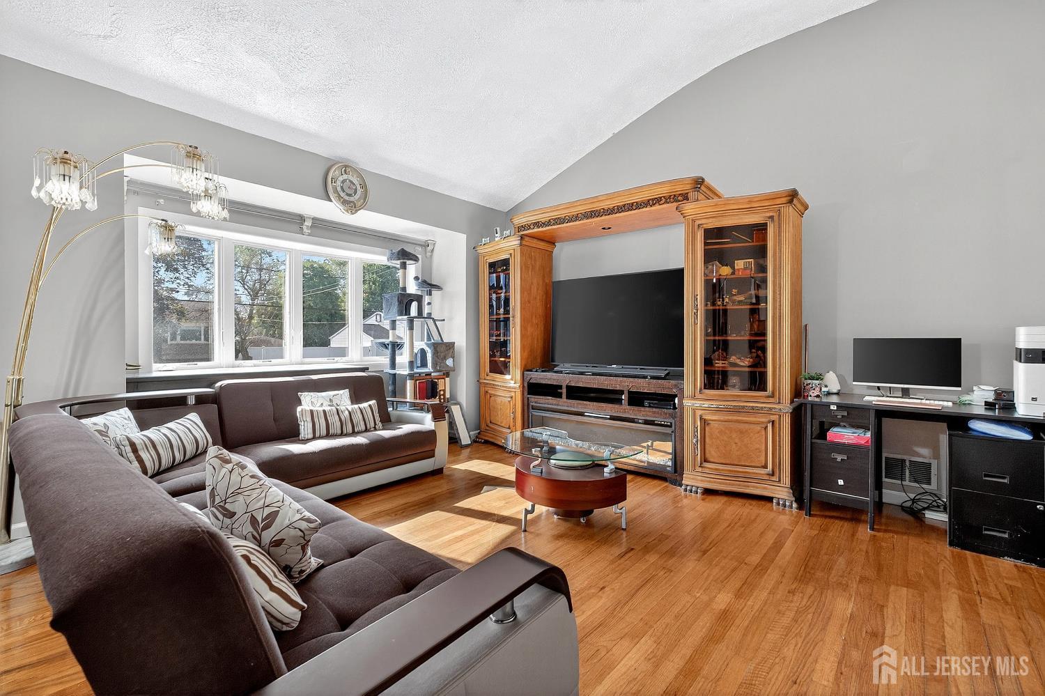 124 Cindy Court Middlesex, NJ 08846 - Photo 5 of 27 a living room with furniture and a flat screen tv
