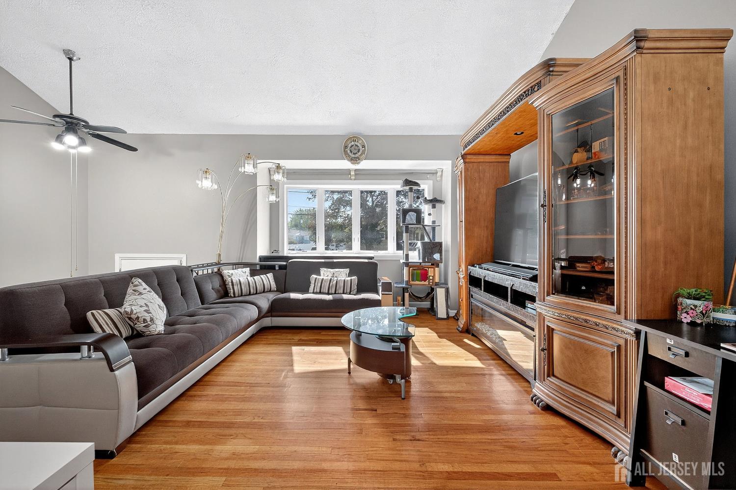124 Cindy Court Middlesex, NJ 08846 - Photo 6 of 27 a living room with furniture and a flat screen tv