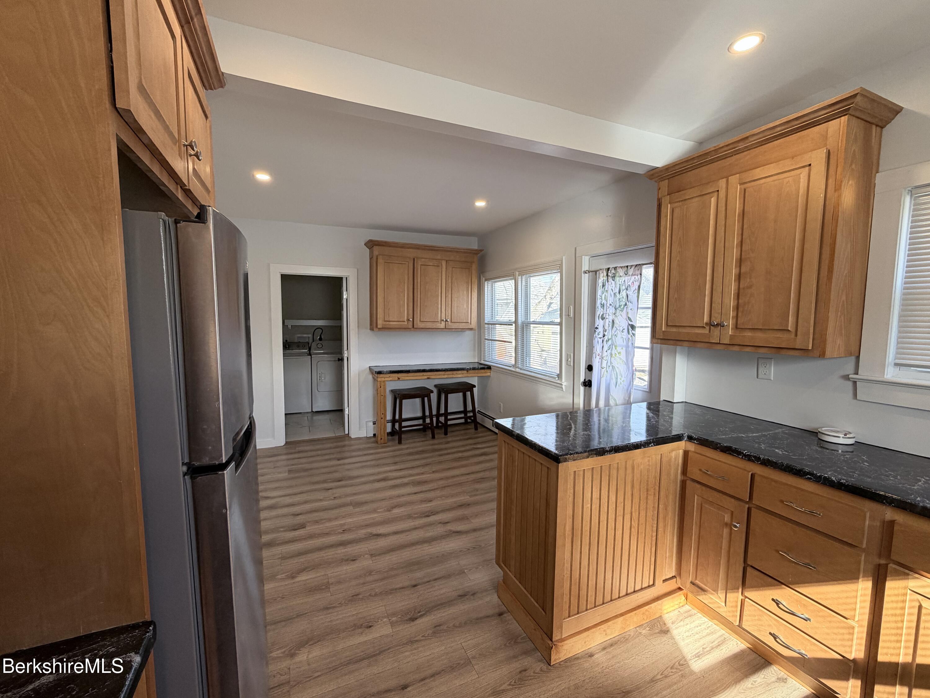 50 Temple Street Adams, MA 01220 - Photo 11 of 14 a kitchen with stainless steel appliances granite countertop a refrigerator sink and cabinets