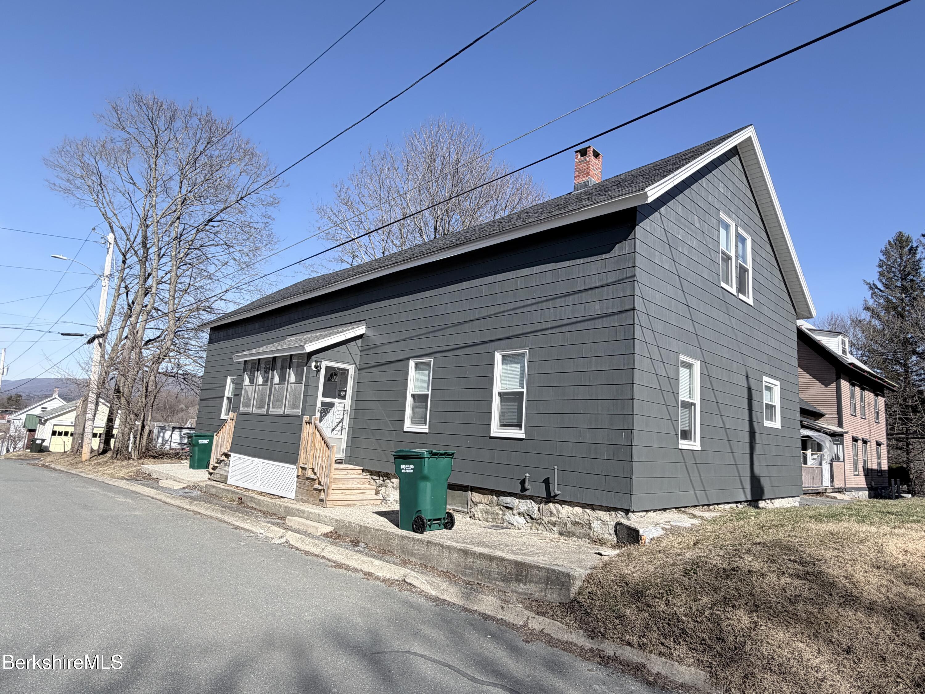 50 Temple Street Adams, MA 01220 - Photo 2 of 14 a front view of a house with a yard and garage