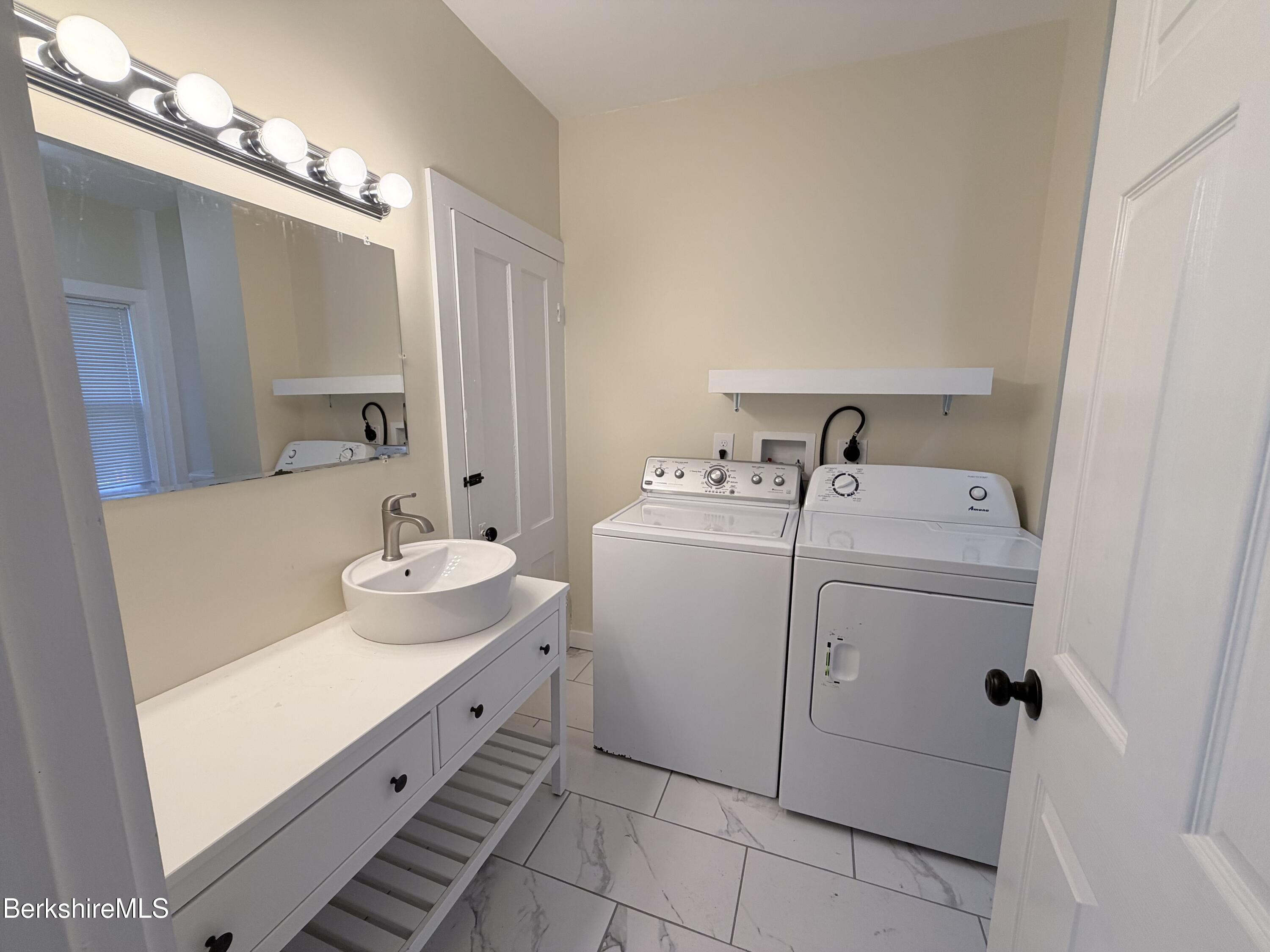 50 Temple Street Adams, MA 01220 - Photo 5 of 14 a bathroom with a sink and a mirror