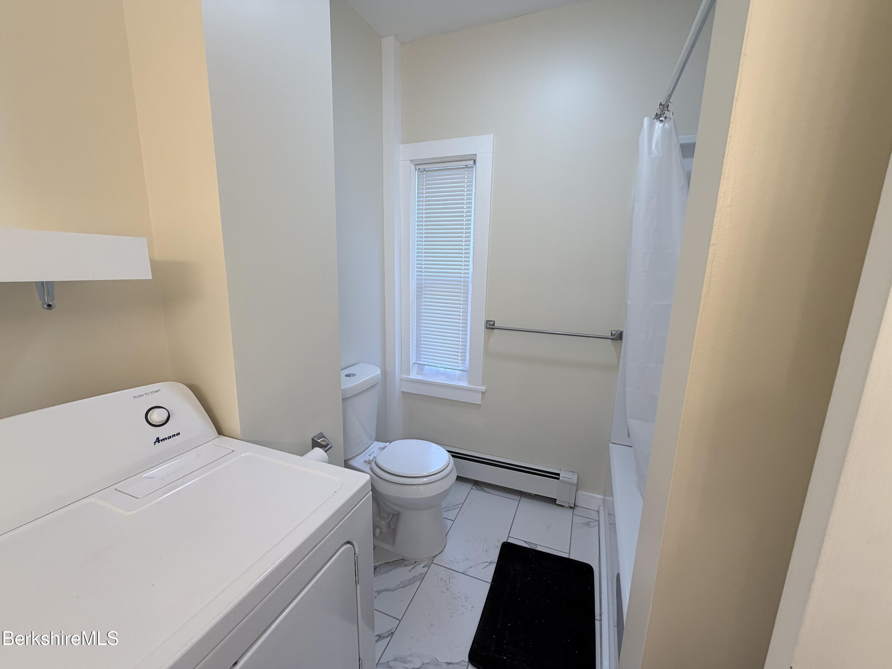 50 Temple Street Adams, MA 01220 - Photo 7 of 14 a bathroom with a toilet and a mirror