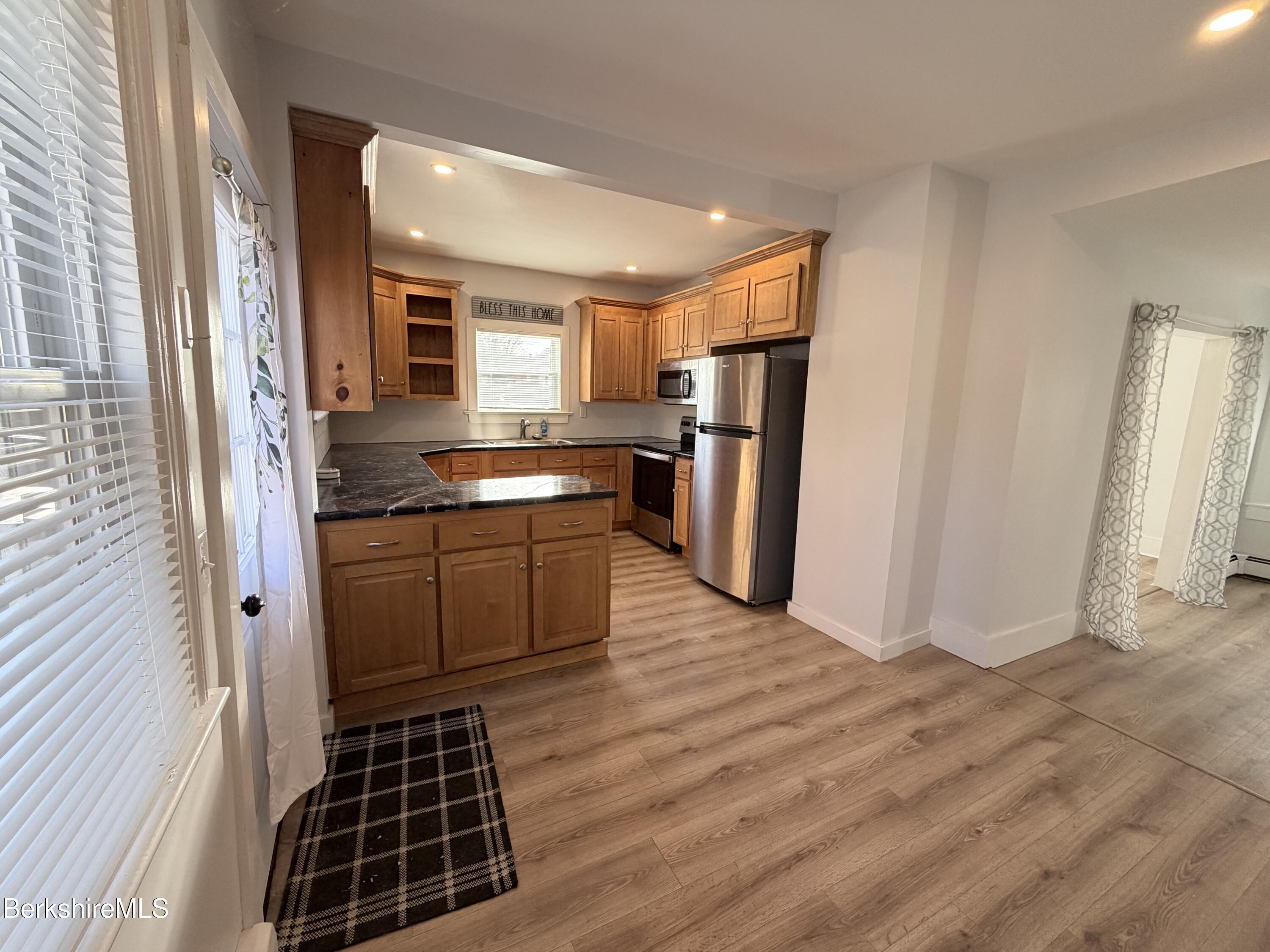 50 Temple Street Adams, MA 01220 - Photo 8 of 14 a kitchen with stainless steel appliances a refrigerator and a sink