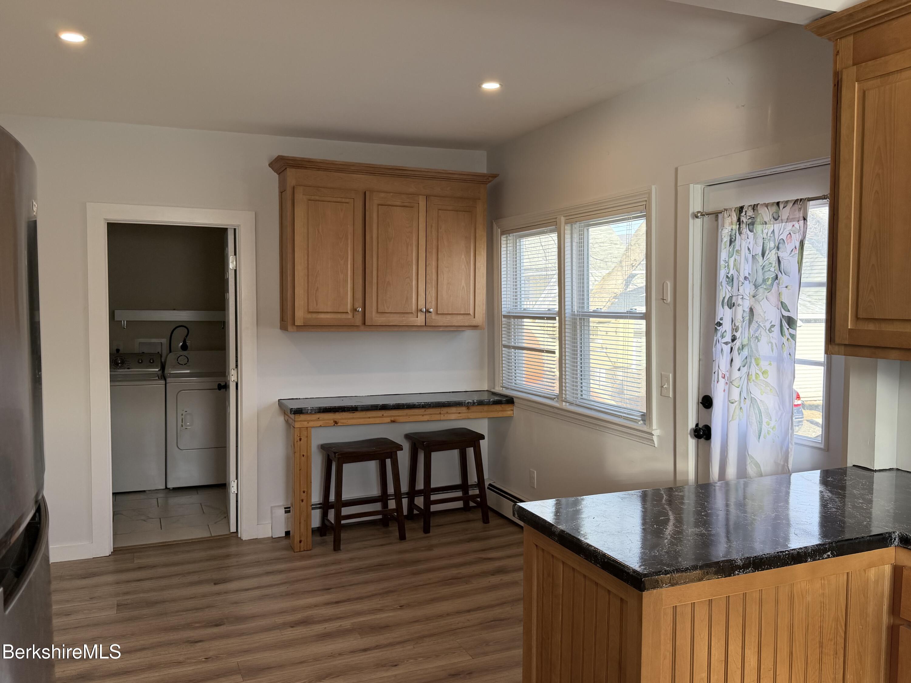 50 Temple Street Adams, MA 01220 - Photo 10 of 14 a kitchen with granite countertop a stove a sink and a refrigerator
