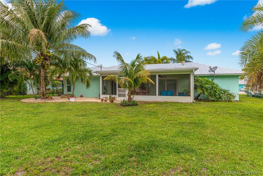 4780 Southeast Glen Ridge Trail Stuart, FL 34997 - Photo 28 of 31 a view of a house with a backyard