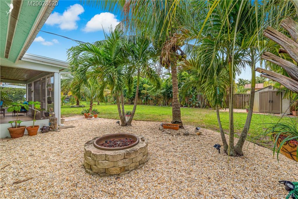 4780 Southeast Glen Ridge Trail Stuart, FL 34997 - Photo 30 of 31 a view of a backyard with garden