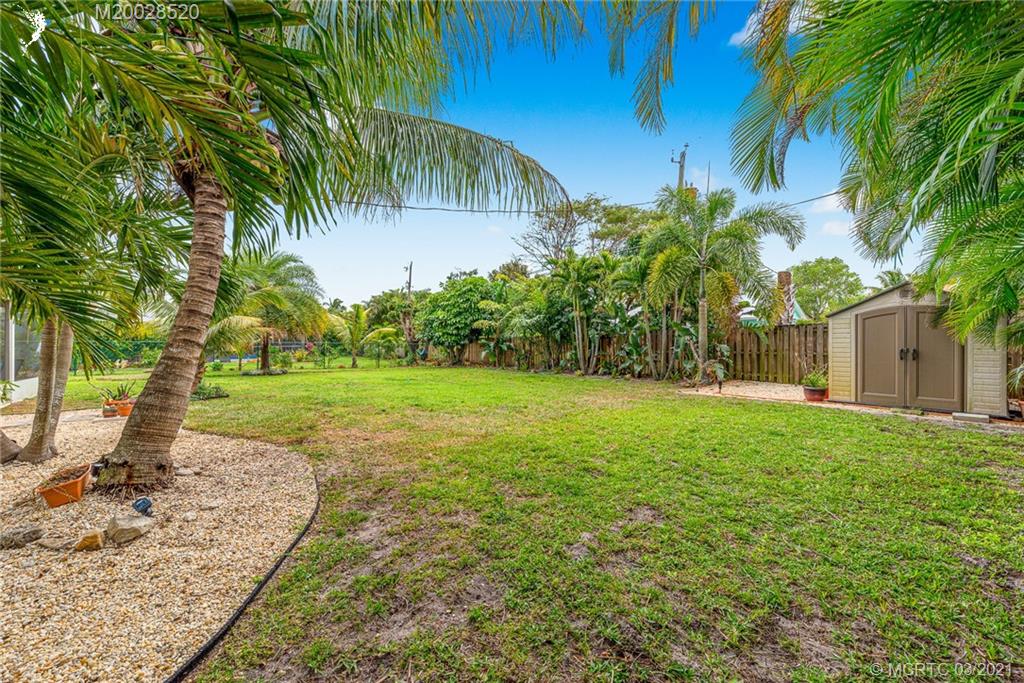 4780 Southeast Glen Ridge Trail Stuart, FL 34997 - Photo 31 of 31 a view of a yard with palm trees