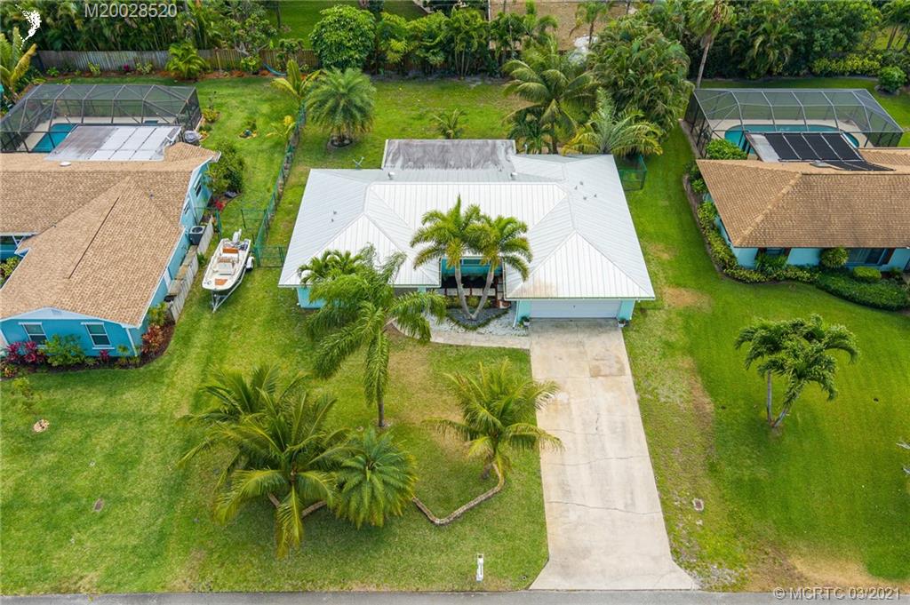 4780 Southeast Glen Ridge Trail Stuart, FL 34997 - Photo 5 of 31 an aerial view of a house with a garden