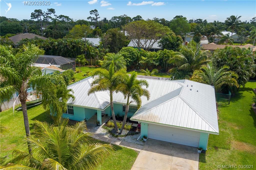 4780 Southeast Glen Ridge Trail Stuart, FL 34997 - Photo 6 of 31 an aerial view of a house with swimming pool and garden