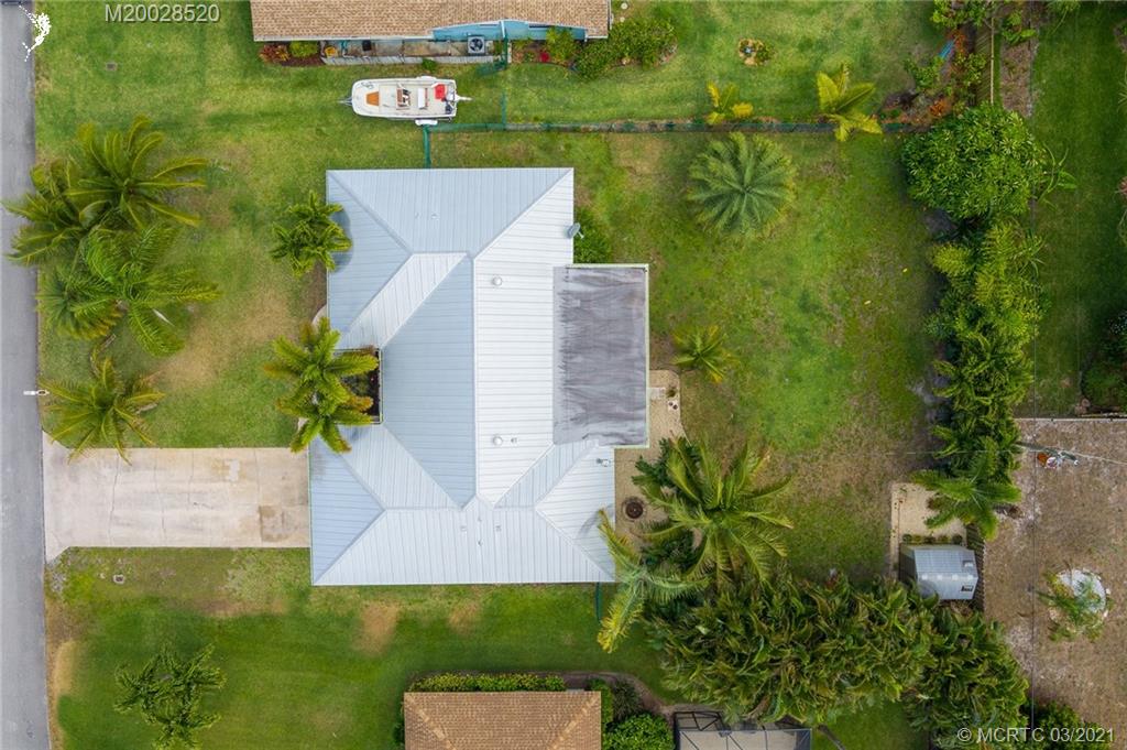 4780 Southeast Glen Ridge Trail Stuart, FL 34997 - Photo 7 of 31 an aerial view of a house with a yard