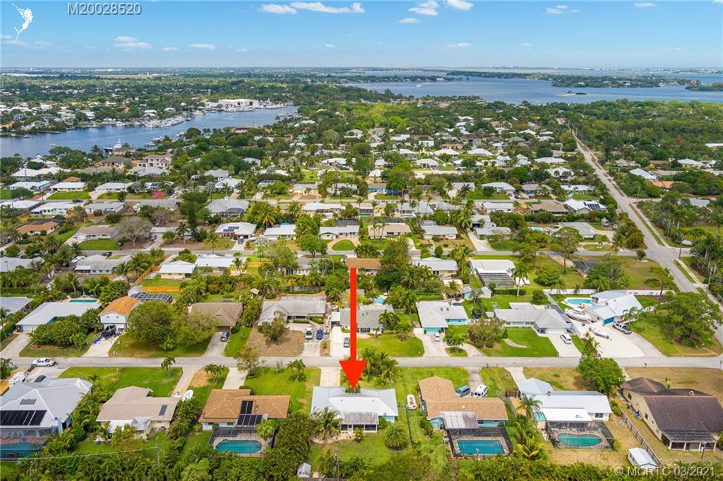 4780 Southeast Glen Ridge Trail Stuart, FL 34997 - Photo 9 of 31 an aerial view of residential building and lake