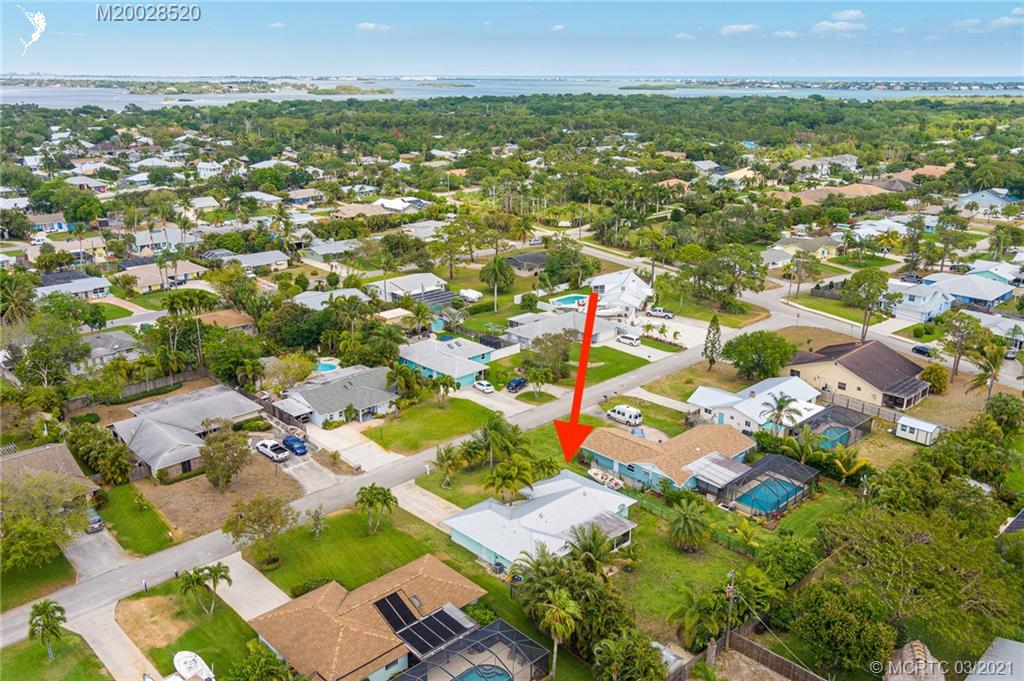 4780 Southeast Glen Ridge Trail Stuart, FL 34997 - Photo 10 of 31 an aerial view of residential houses with outdoor space and trees all around
